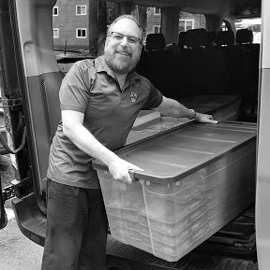 Man loading food off a truck